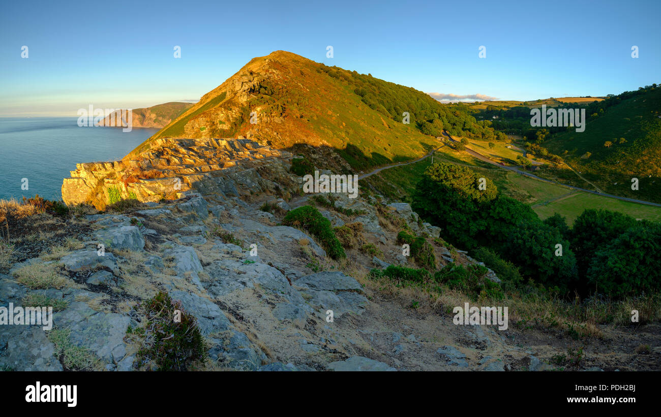 Summer sunset over the Valley of Rocks, near Lynton in the Exmoor National Park, Devon, UK Stock Summer sunset over the Valley of Rocks, near Lynton in the Exmoor National Park, Devon, UK Stock