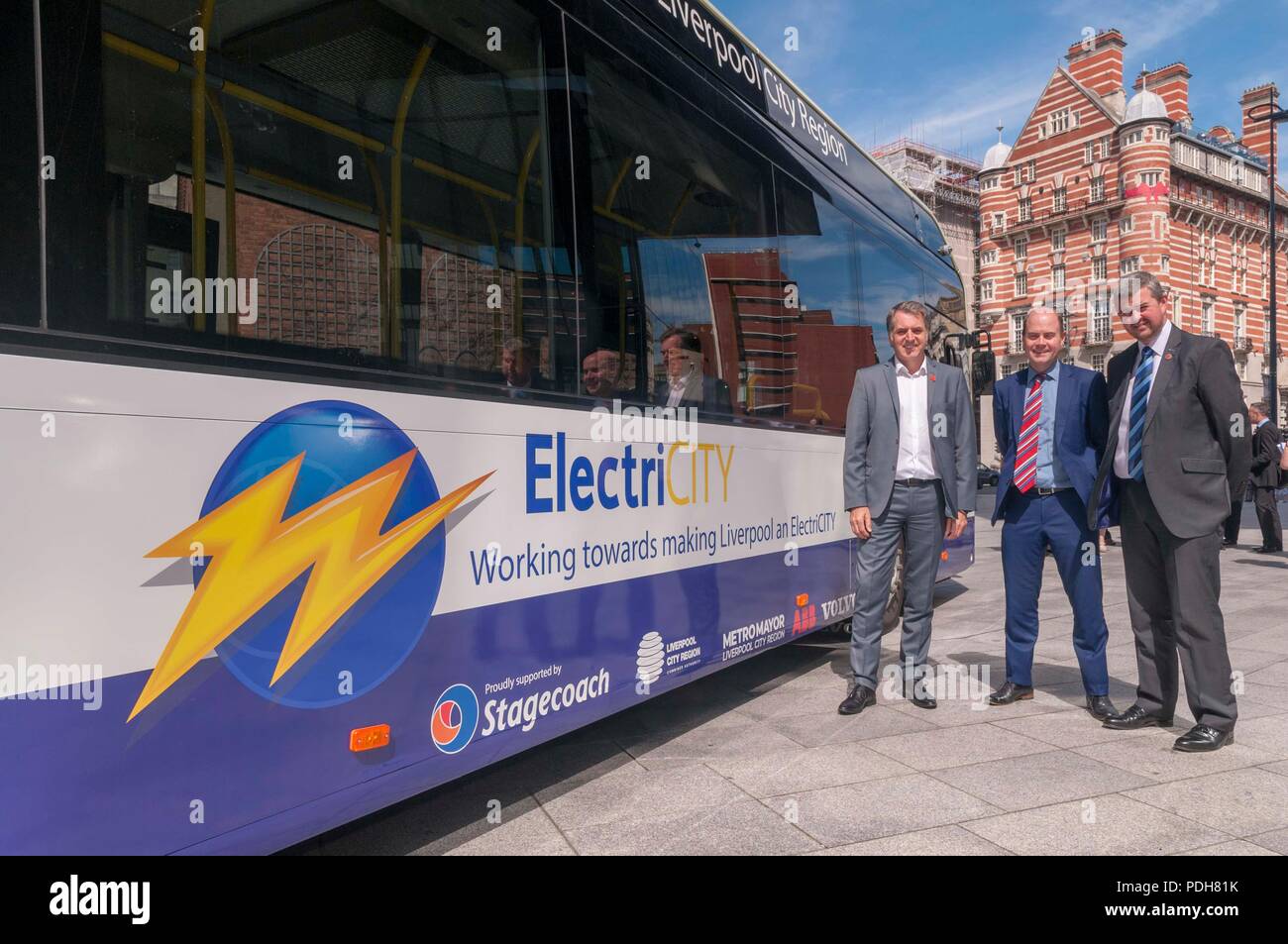 Liverpool, UK. , . Merseytravel Experimental rechargeable Stagecoach bus event. L To R. Steve Roterham Metro Mayor of Liverpool. Cllr Liam Robinson and Stagecoah Merseyside and Sth Lancs M.D. Rob Jones during the launch of the trial at Liverpools Mann Island today. Credit: John Davidson/Alamy Live News Stock Photo