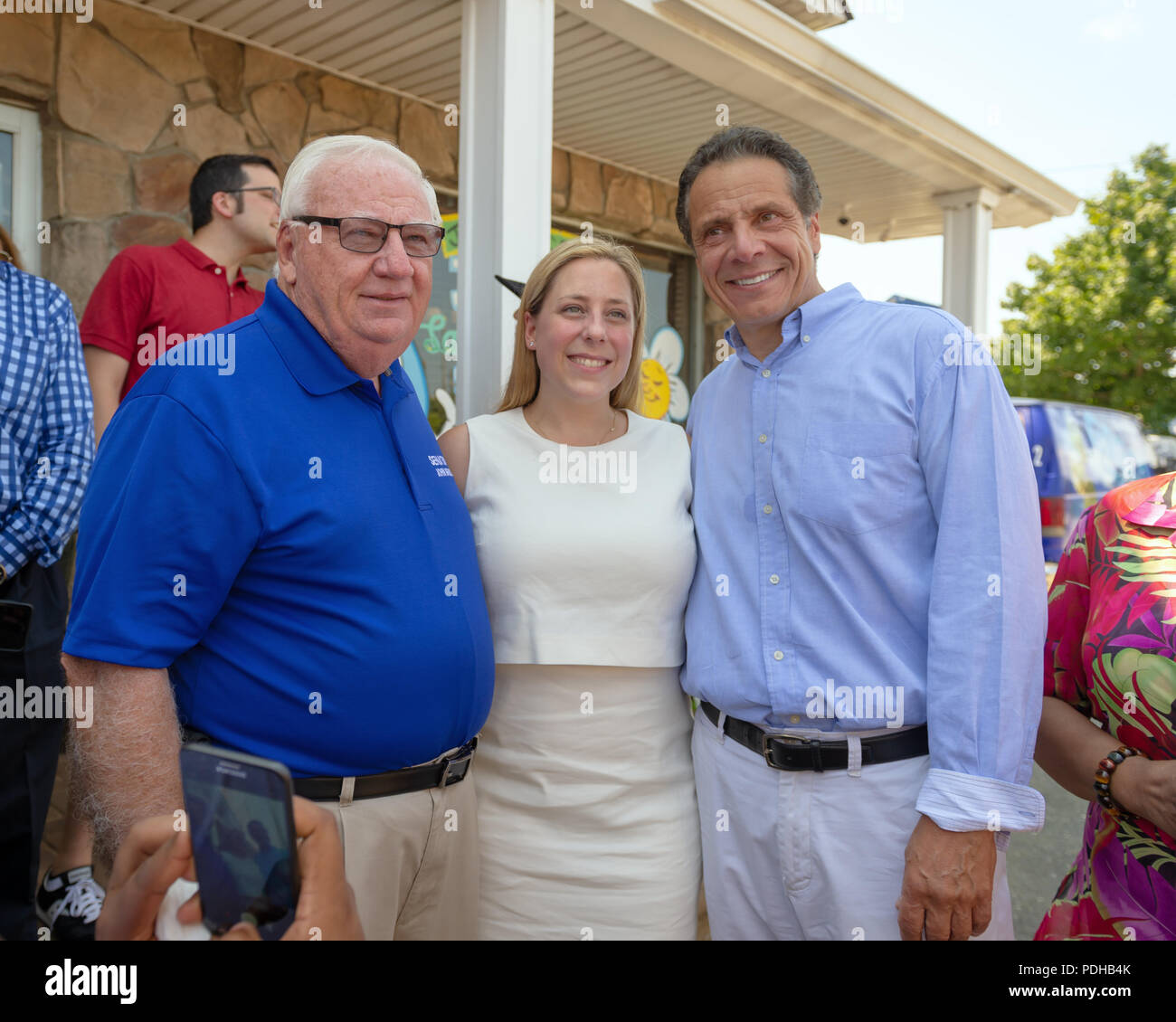 Massapequa, New York, USA. 5th Aug, 2018. L-R, NY Senator JOHN BROOKS; LIUBA GRECHEN SHIRLEY, Congressional candidate for NY 2nd District; and Governor ANDREW CUOMO, running for re-election, pose among supporters during opening of joint campaign office for the 2 Long Islanders, aiming for a Democratic Blue Wave in November midterm elections. Credit: Ann Parry/ZUMA Wire/Alamy Live News Stock Photo