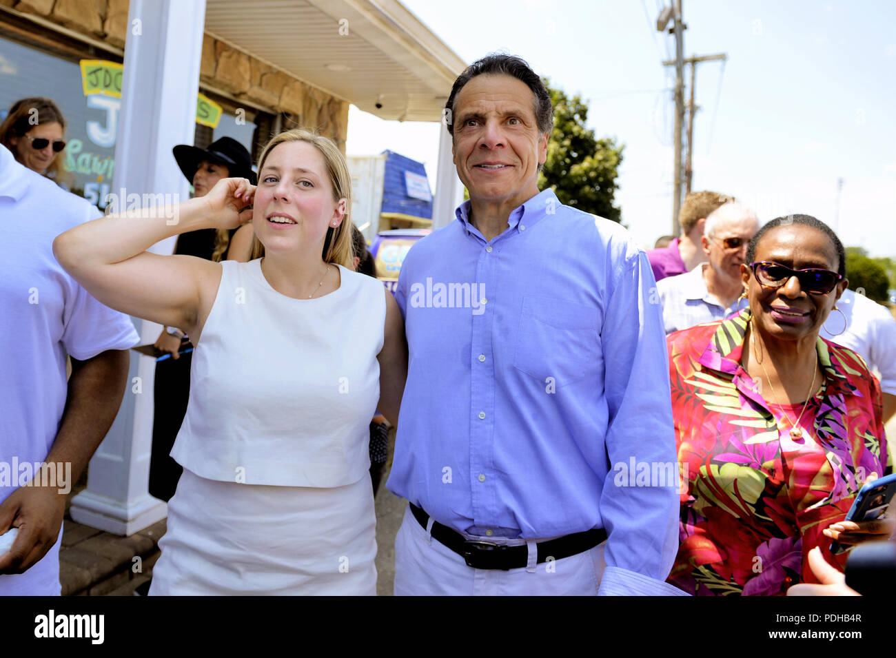 Massapequa, New York, USA. 5th Aug, 2018. L-R, LIUBA GRECHEN SHIRLEY, Congressional candidate for NY 2nd District, and Governor ANDREW CUOMO, running for re-election, walk together with supporters during joint campaign office opening for Grechen Shirley and NY Sen. J. Brooks, aiming for a Democratic Blue Wave in November midterm elections. Credit: Ann Parry/ZUMA Wire/Alamy Live News Stock Photo