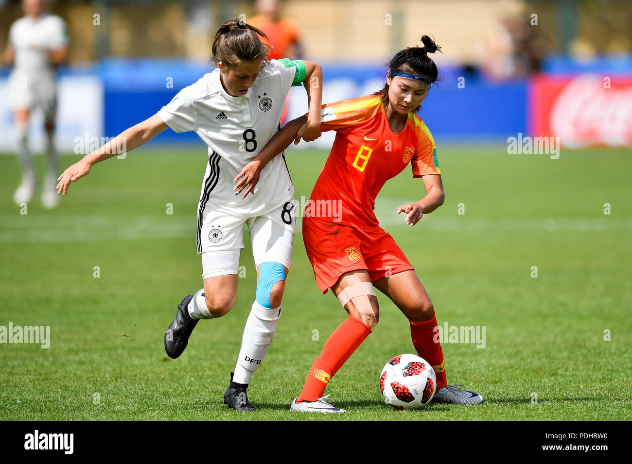 Saint Malo. 9th Aug, 2018. Shen Mengyu (R) of China vies with Jana Feldkamp of Germany during a Group D match at the FIFA U-20 Women's World Cup France 2018 in Saint-Malo, France on Aug. 9, 2018. Germany won 2-0. Credit: Chen Yichen/Xinhua/Alamy Live News Stock Photo