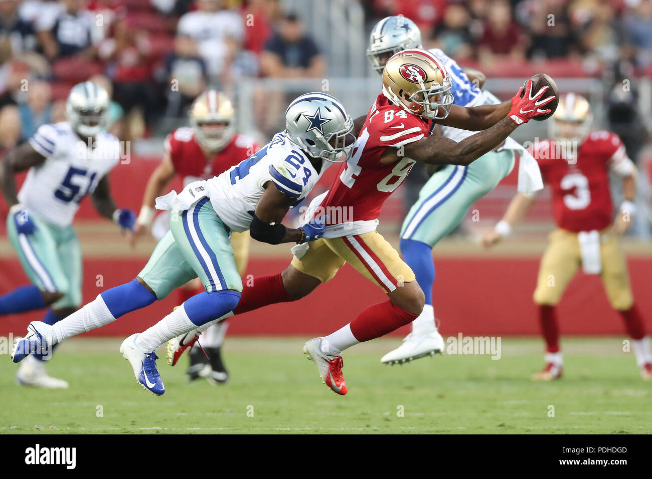 San Jose, USA. August 8, 2018: San Francisco 49ers wide receiver Kendrick Bourne (84) makes a leaping catch ahead of trailing defender Dallas Cowboys cornerback Chidobe Awuzie (24) in the game between the Dallas Cowboys and San Francisco 49ers, Levi Stadium, San Jose, CA. Photographer: Peter Joneleit Credit: Cal Sport Media/Alamy Live News Stock Photo