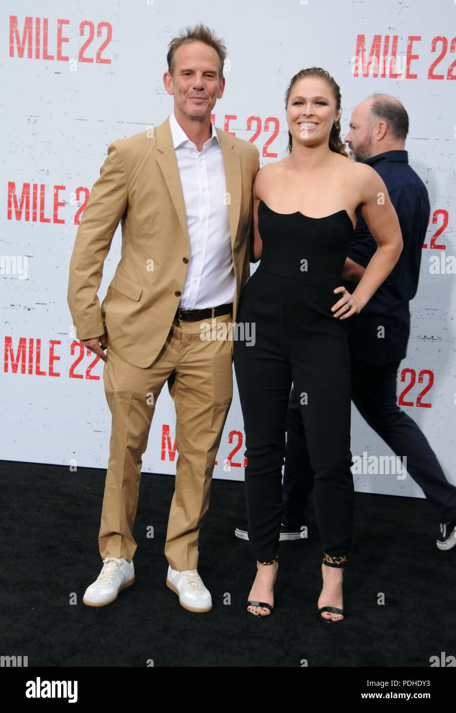 WESTWOOD, CA - AUGUST 09: Director Peter Berg and actress Ronda Rousey attend the premiere of STX Films' 'Mile 22' on August 9, 2018 at Mann Village Theatre in Westwood, California. Photo by Barry King/Alamy Live News Stock Photo