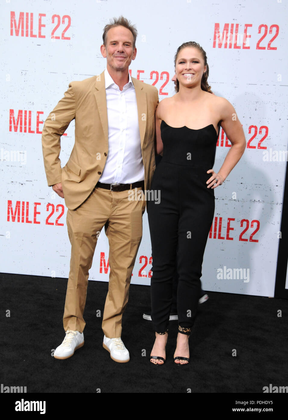 WESTWOOD, CA - AUGUST 09: Director Peter Berg and actress Ronda Rousey attend the premiere of STX Films' 'Mile 22' on August 9, 2018 at Mann Village Theatre in Westwood, California. Photo by Barry King/Alamy Live News Stock Photo
