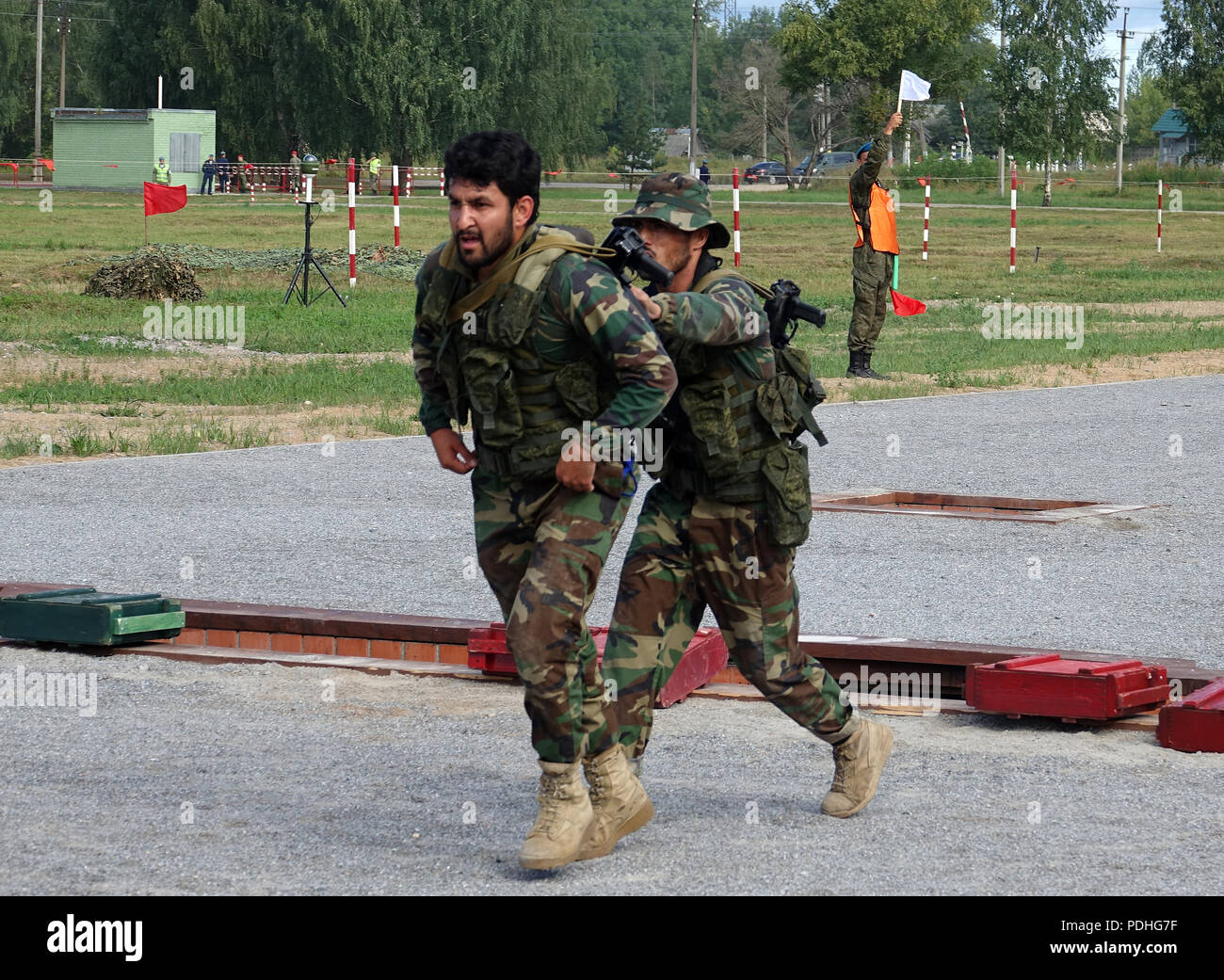 Pskow, Russia. 07th Aug, 2018. Pakistani paratroopers drive each other on the obstacle course of the International Army Games at the training area of the 76th Russian paratrooper division near Pskow. Teams from 32 nations are competing against each other in the Olympics of military skills. (on dpa 'Aircraft Darts and Tank Biathlon: Russia's Great Army Competition' of 10.08.2018) Credit: Friedemann Kohler/dpa/Alamy Live News Stock Photo