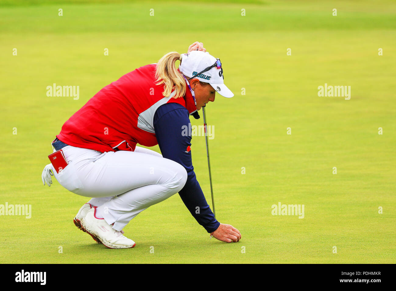 Gleneagles, Scotland, UK. 10th August, 2018. The Fourball Match Play continues with the pairing of Catriona Matthew and Holly Clyburn representing Great Britain playing against Cajsa Persson and Linda Wessberg of Sweden. Clyburn setting up the putt at the third hole Credit: Findlay/Alamy Live News Stock Photo