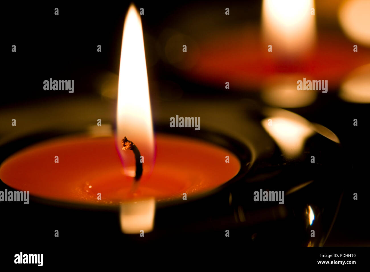 two candles flaming in the dark closeup Stock Photo Alamy