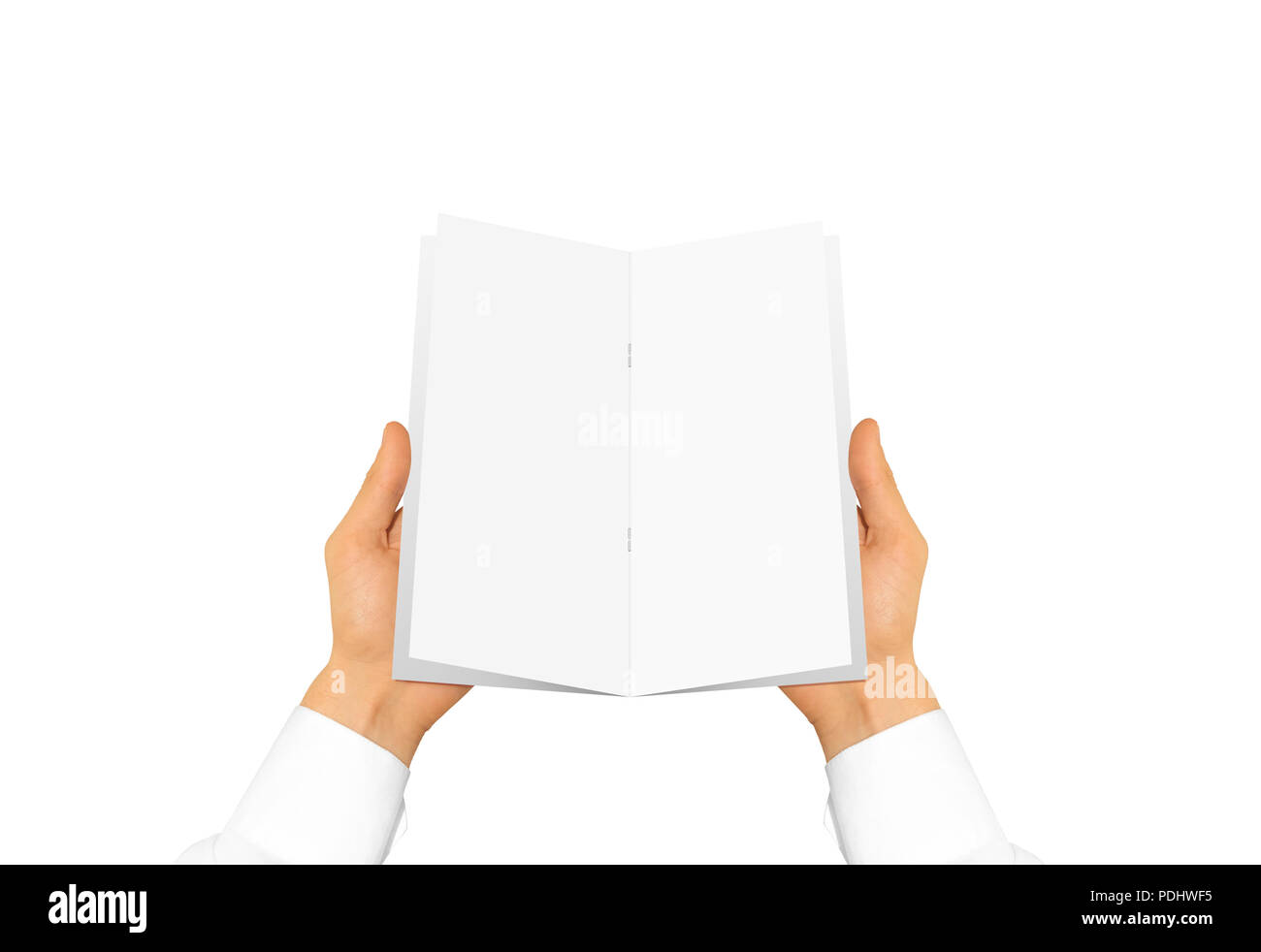 Hand in white shirt sleeve holding blank brochure booklet in the hand. Leaflet presentation. Pamphlet hand man. Man show paper. Sheet template. Menu in hands. Booklet design. Fold paper sheet display. Stock Photo
