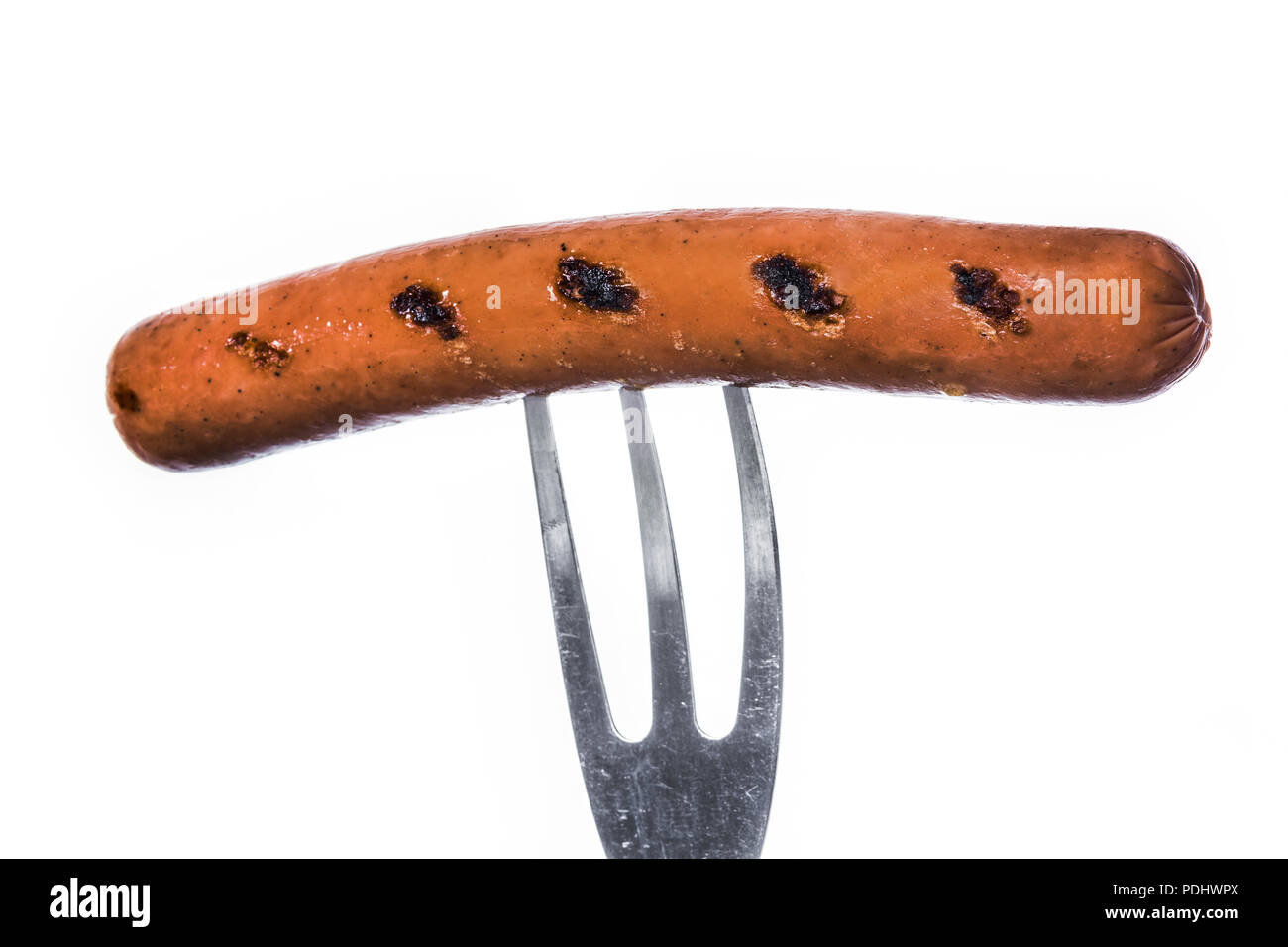 Grilled sausage on a fork isolated on white background Stock Photo