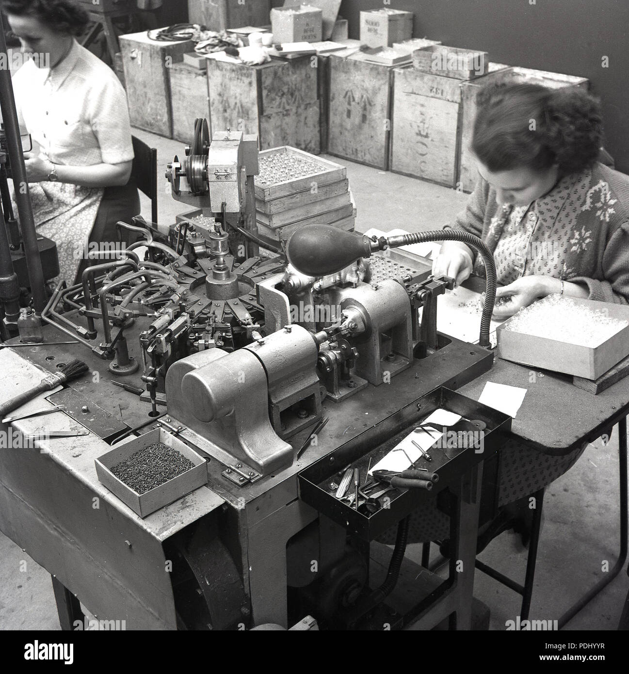 1950s, historical, female worker in a factory. The industrial needs of