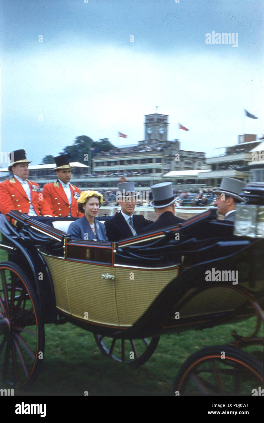 1960s, historical, HRM the Queen and Prince Philip sitting beside each other in an open landau or carriage at Royal Ascot, England, UK. Ascot racecourse in Berkshire holds a special week of horse racing once a year, called 'Royal Ascot' attended by the Queen and other keen racegoers. Stock Photo