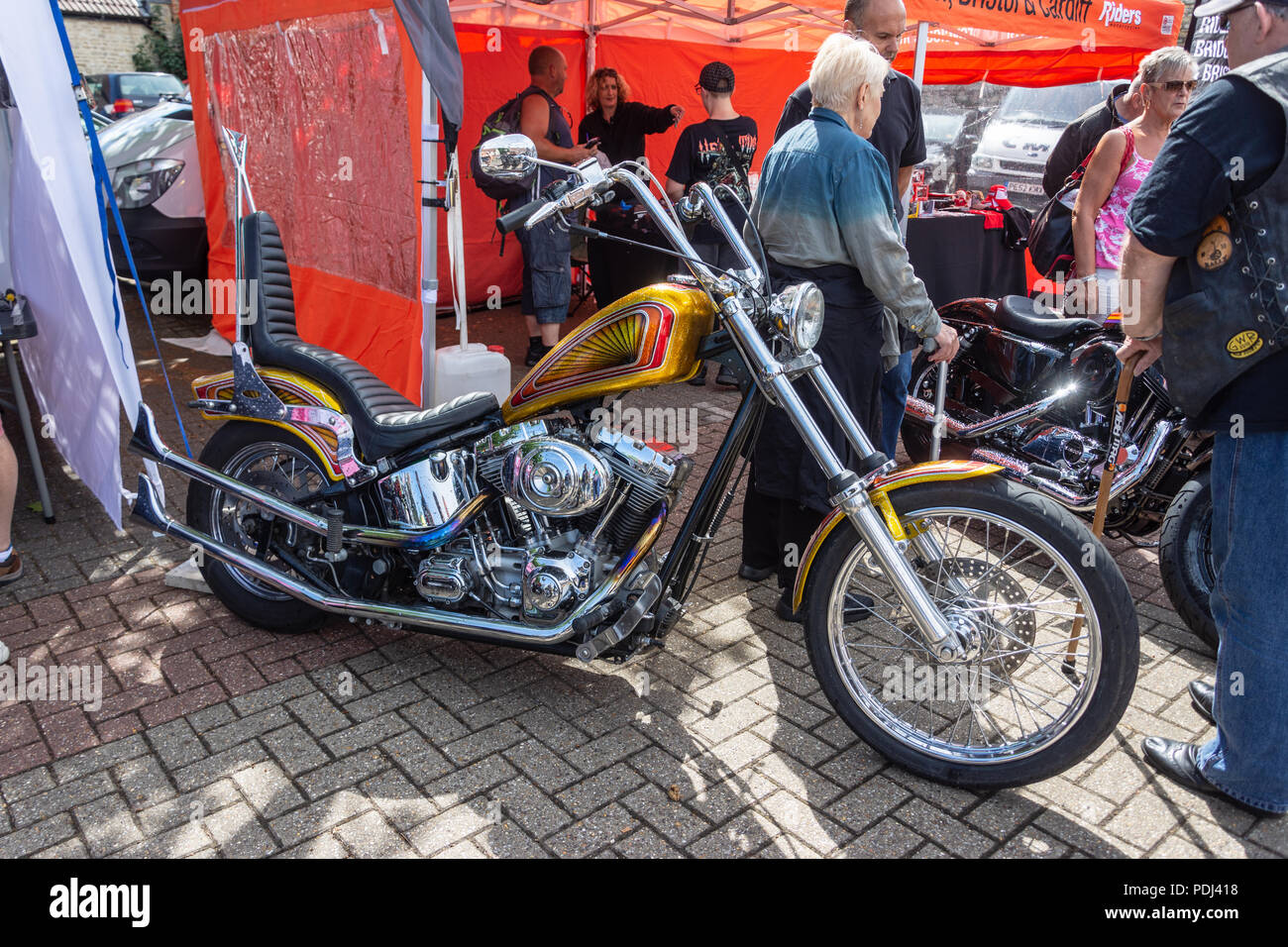 Customized hard tail chopper motorcycle  with glitter paint fuel tank on display at Calne bike meet Stock Photo