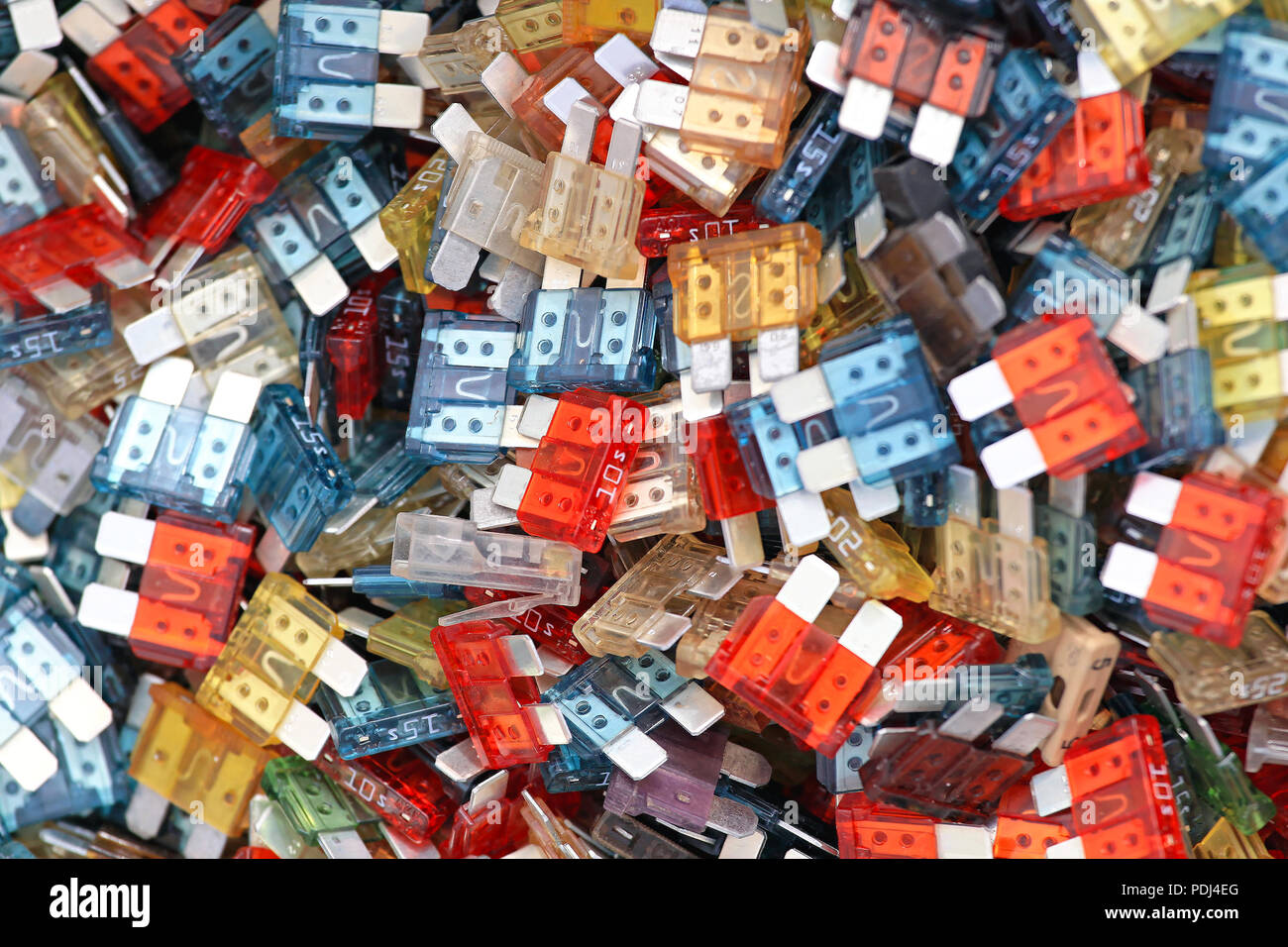 Bunch of color coded automotive fuses Stock Photo Alamy
