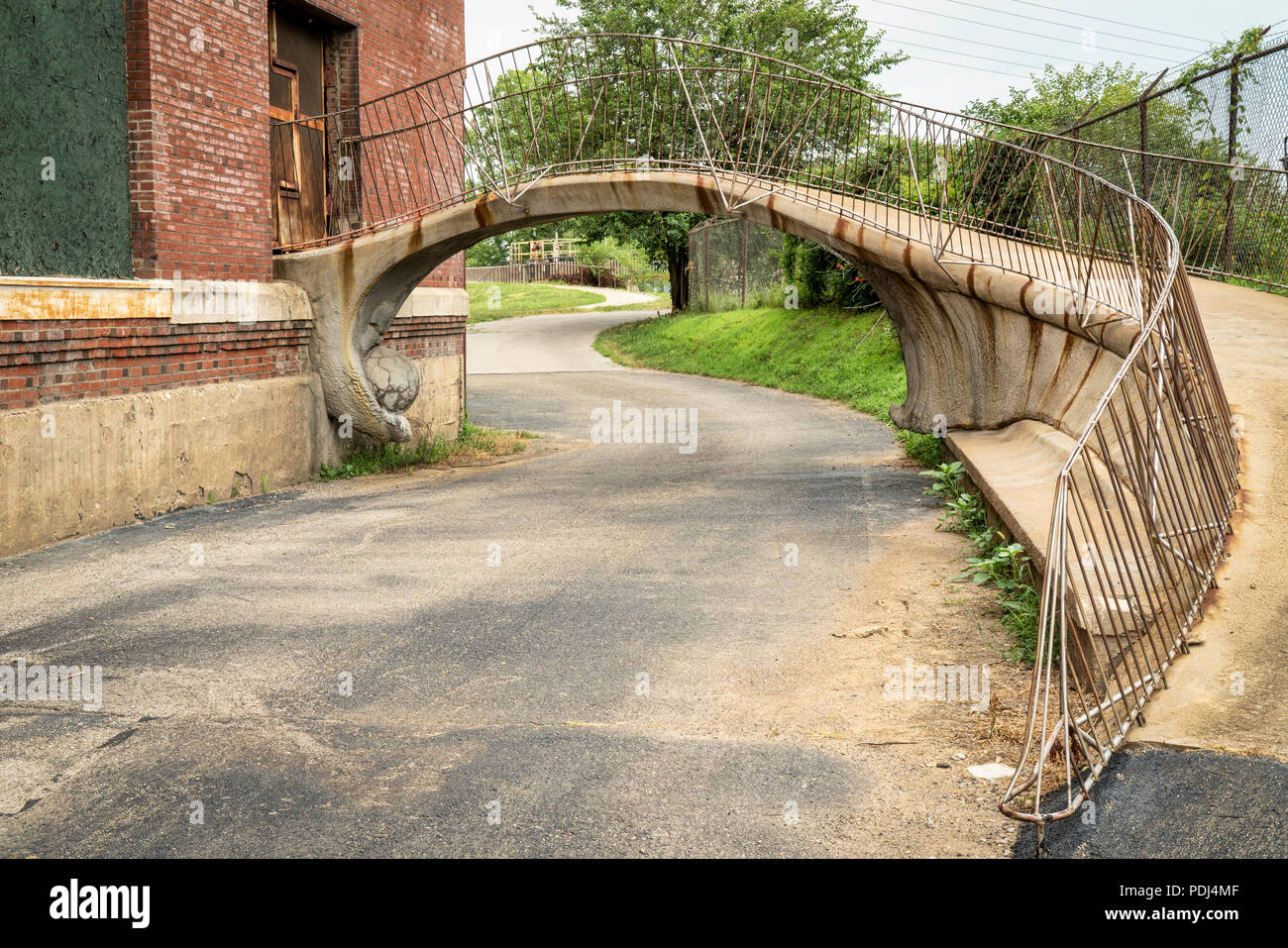 St Louis Riverfront Trail under a footbridge in old industrial area along the MIssissipi River, Stock Photo