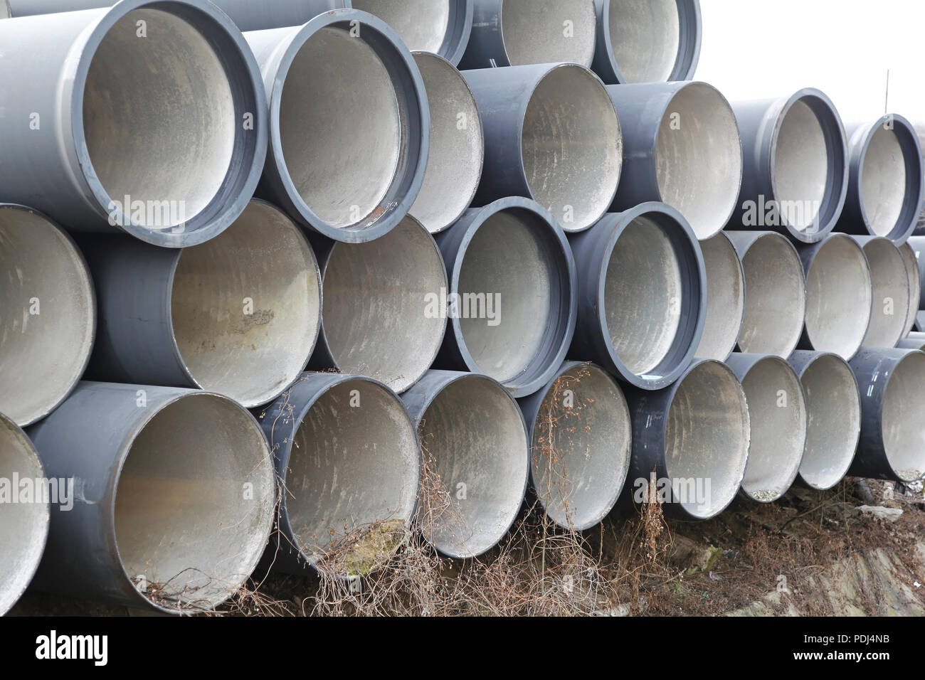Big ceramic sewage pipes ready for underground instalation Stock Photo