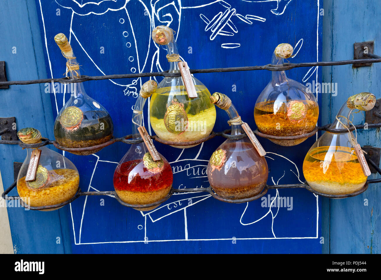 Colourful antique chemical flasks as used in alchemy Stock Photo