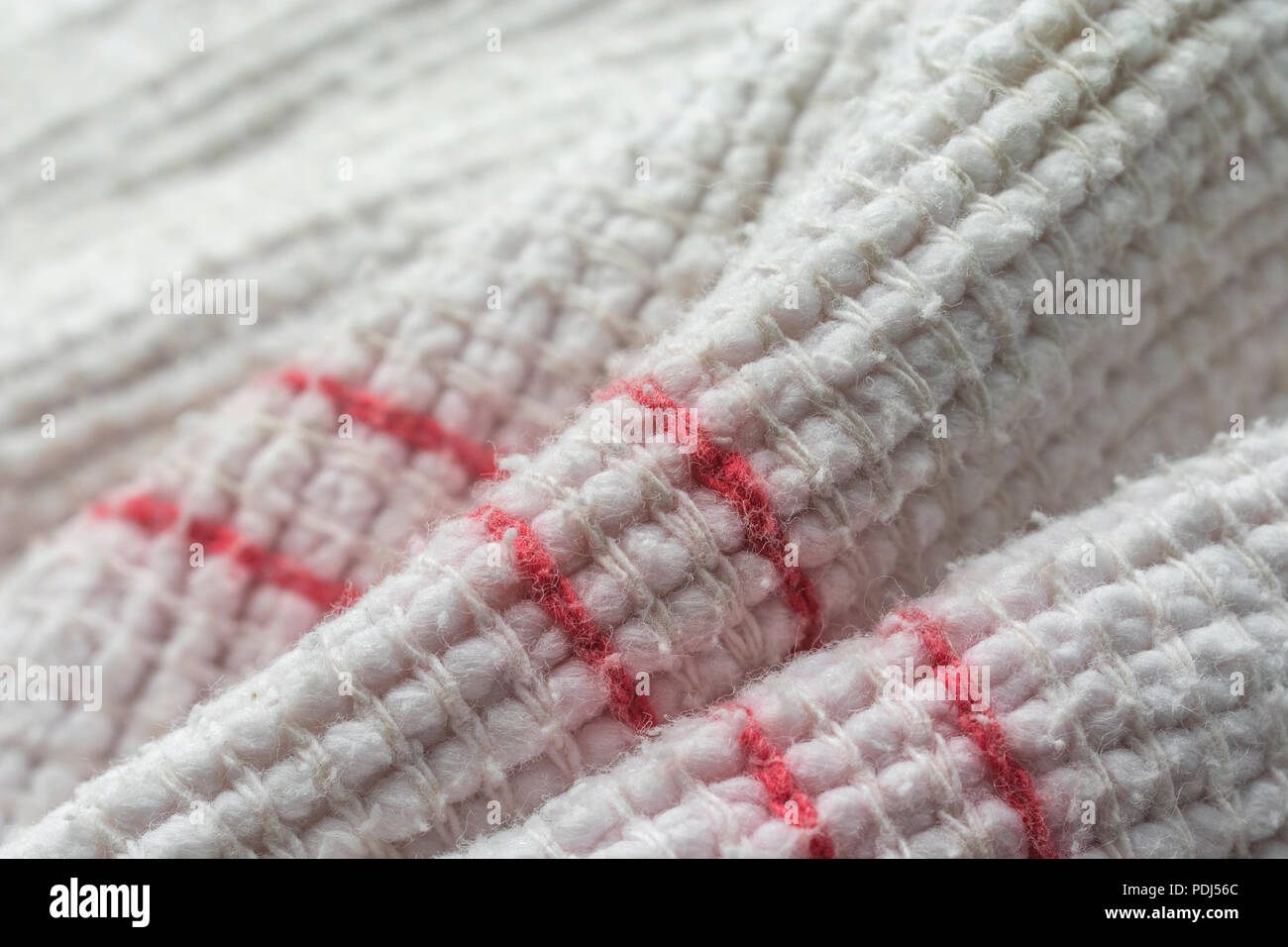Close-up macro shot of oven cloth. Stitched line, line of stitches. Stock Photo