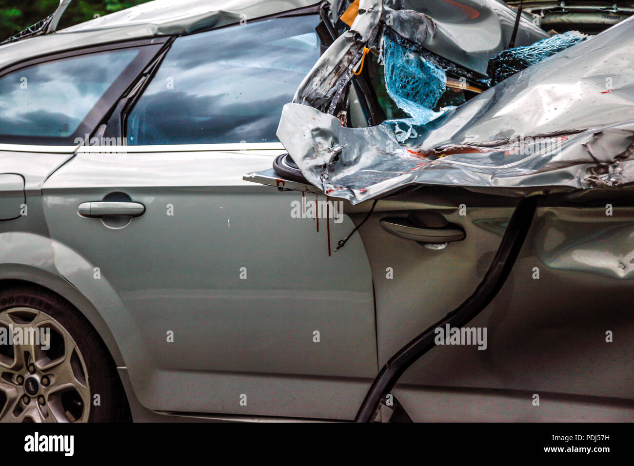 Blood splattered car wreck on the side of the autobahn in Germany Stock Photo