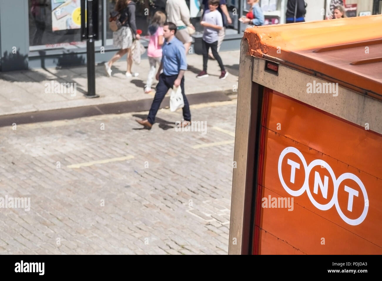 A TNT delivery van on the street in Truro City centre in Cornwall. Stock Photo