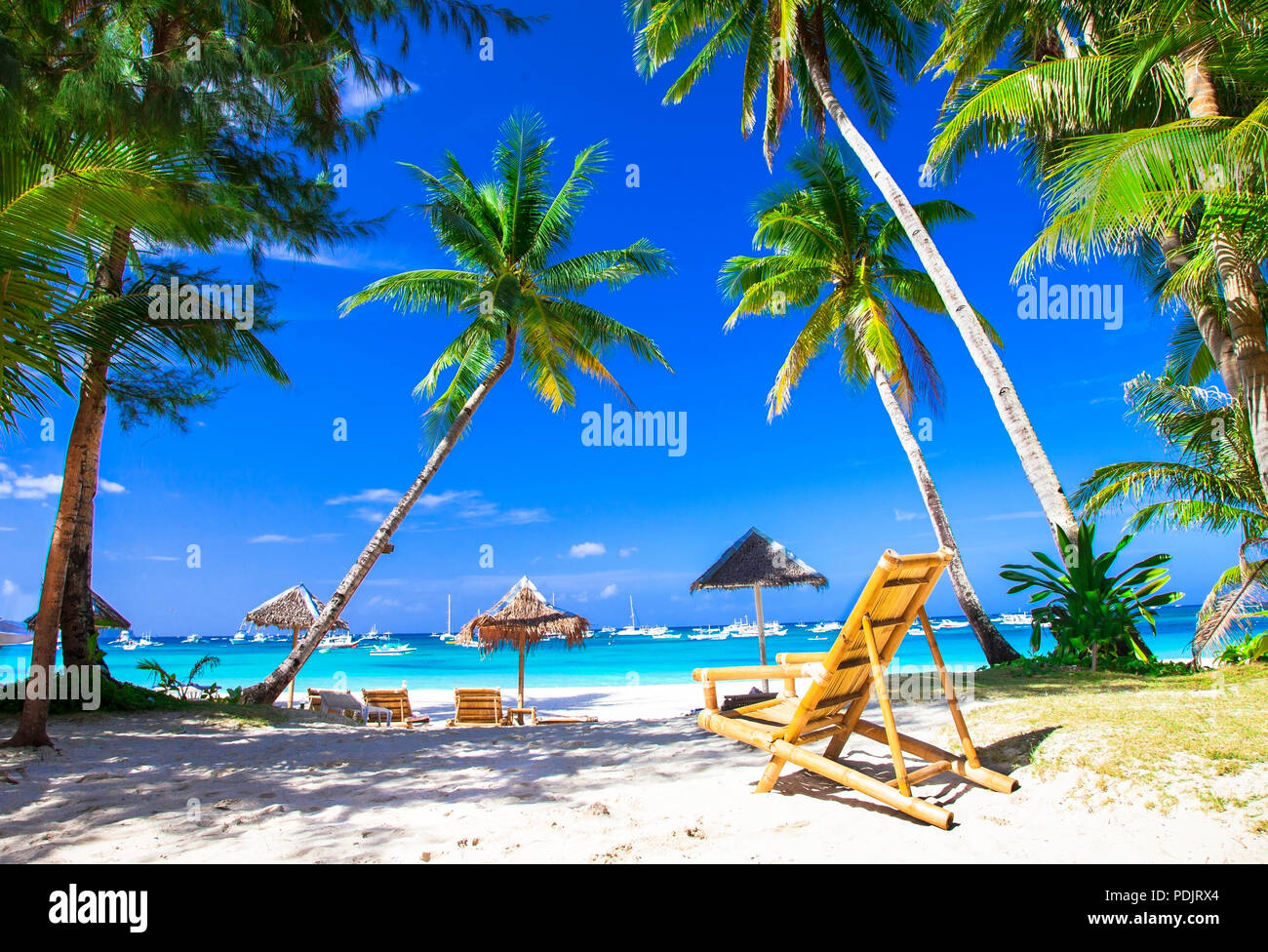 Beautiful Boracay island,view with palm trees azure sea and umbrellas,Philippines. Stock Photo