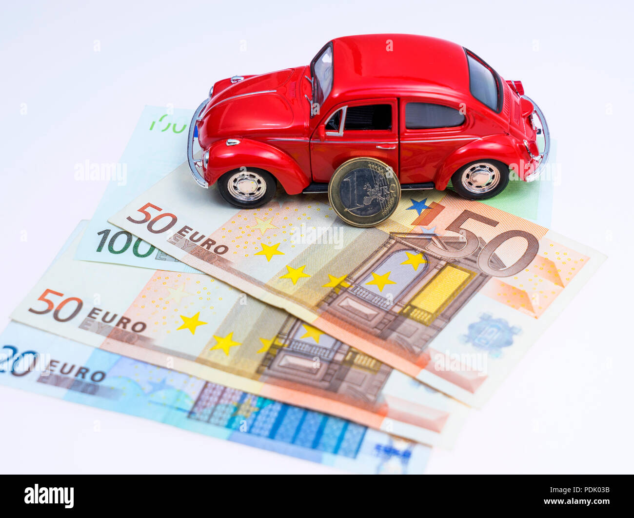 Modellauto und Euro Scheine und Muenzen Stock Photo