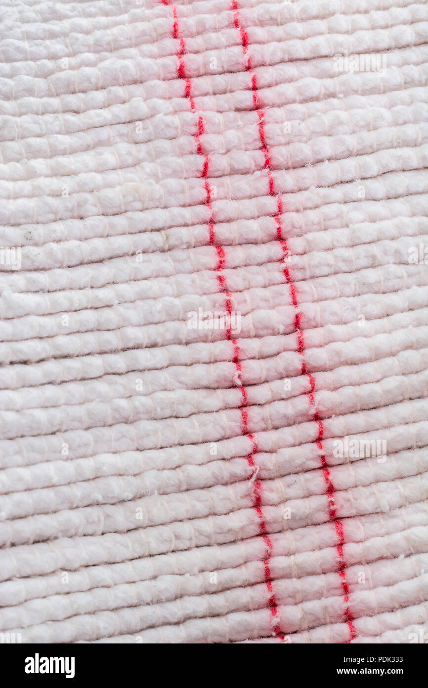 Close-up macro shot of kitchen oven cloth. Stitched line, line of stitches. Stock Photo