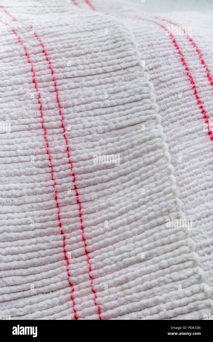 Close-up macro shot of kitchen oven cloth. Stitched line, line of stitches. Stock Photo