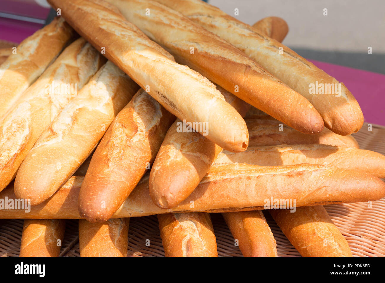 Baguettes, the famous long and thin french bread. Close up of a pile of