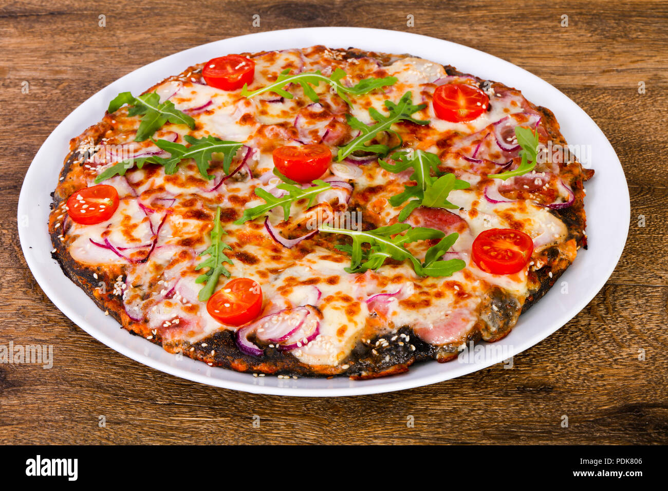 Pizza with ham, cheese and tomatoes Stock Photo Alamy