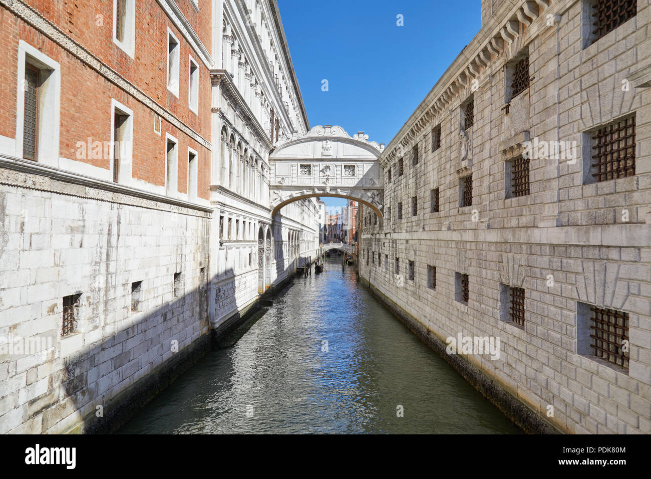 Bridge of Sighs and calm water in the canal, nobody in Venice, Italy Stock Photo