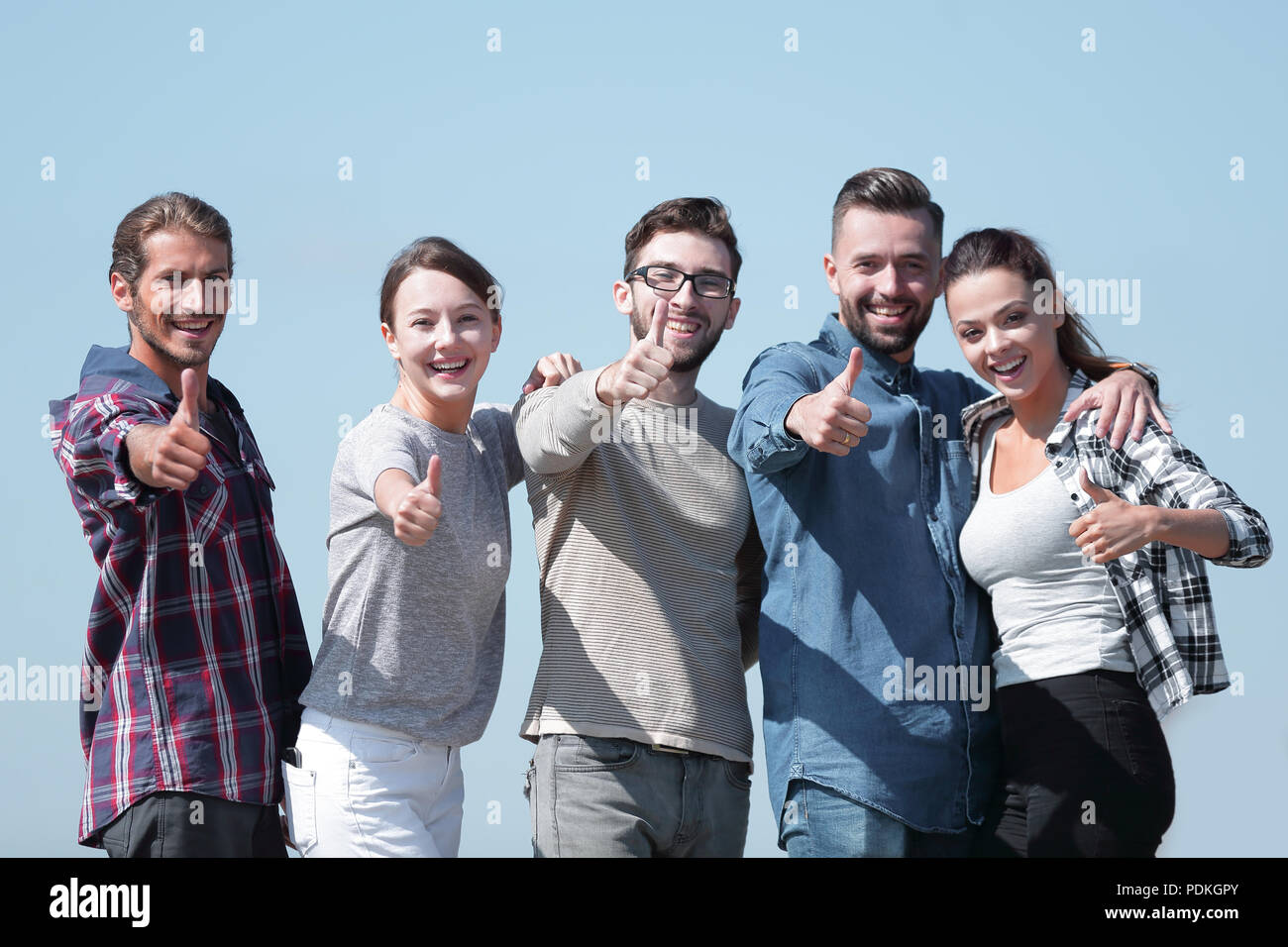group of young people showing thumb up Stock Photo - Alamy
