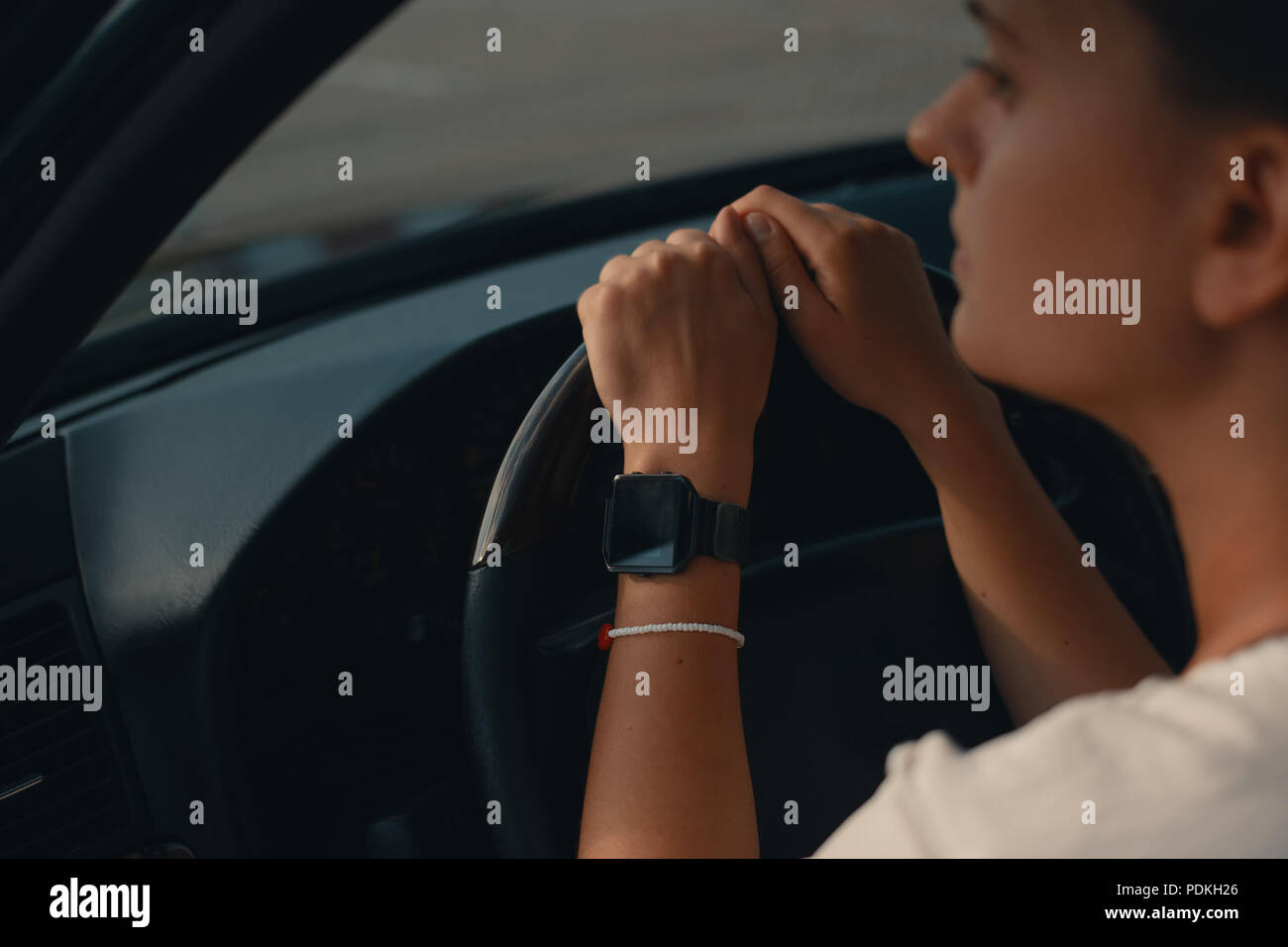 Hands girl on steering wheel hi-res stock photography and images - Alamy