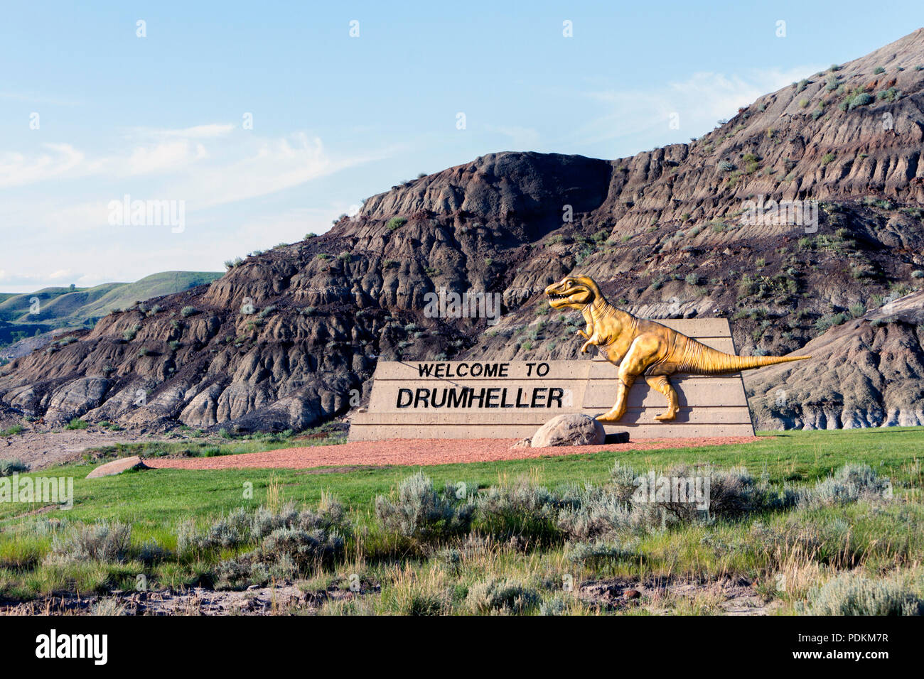 July 12, 2018 Drumheller, Alberta, Canada to Drumheller sign with dinosaur at the