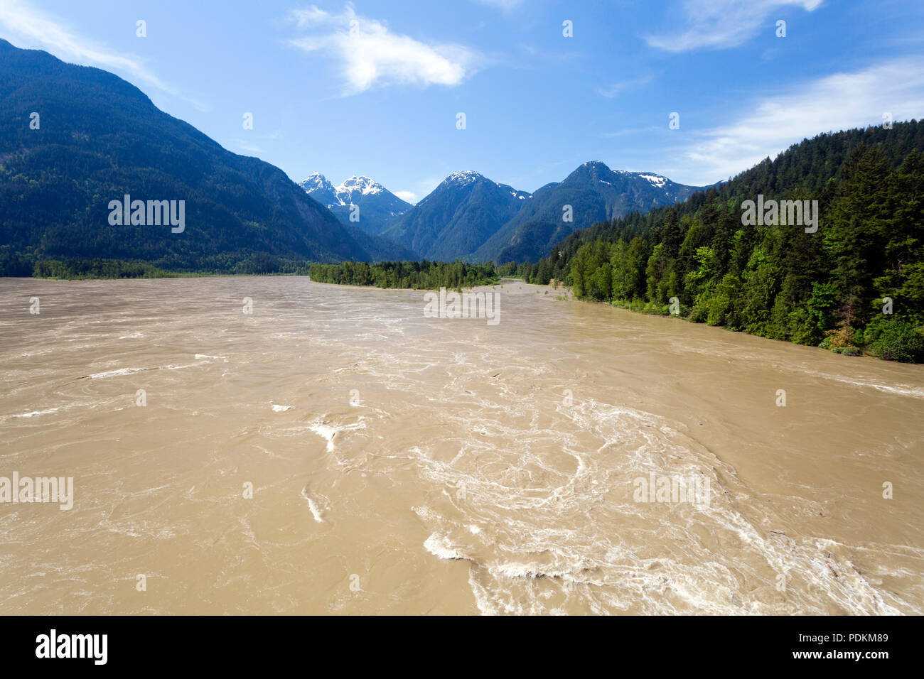 Rapids in the springtime flowing water of the Fraser River in Hope, British Columbia, Canada. Stock Photo