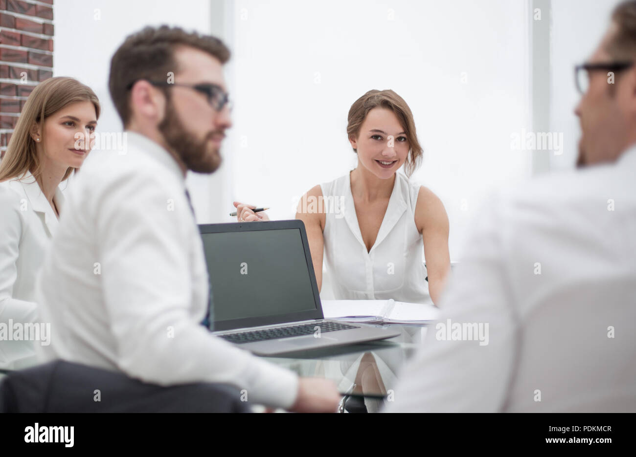 rear view.business colleagues sitting at the Desk Stock Photo - Alamy