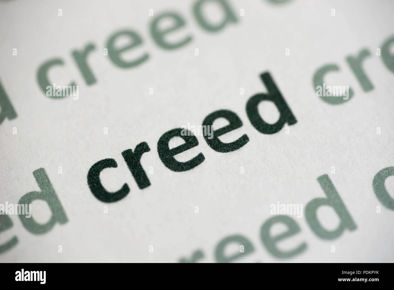 word creed printed on white paper macro Stock Photo