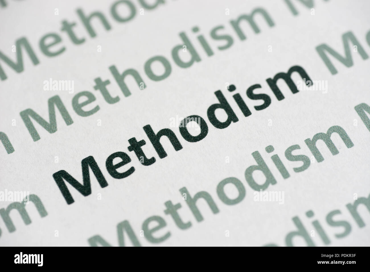 word Methodism printed on white paper macro Stock Photo