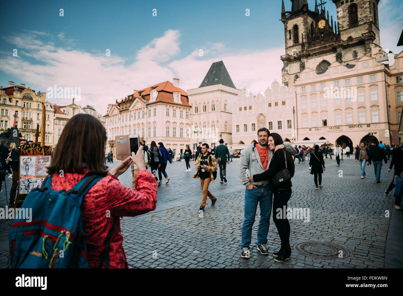 Prague, Czech Republic - September 22, 2017: Woman Photographs Tourists On Smartphone Near Church Of Our Lady Before Tyn In Old Town Square. Stock Photo