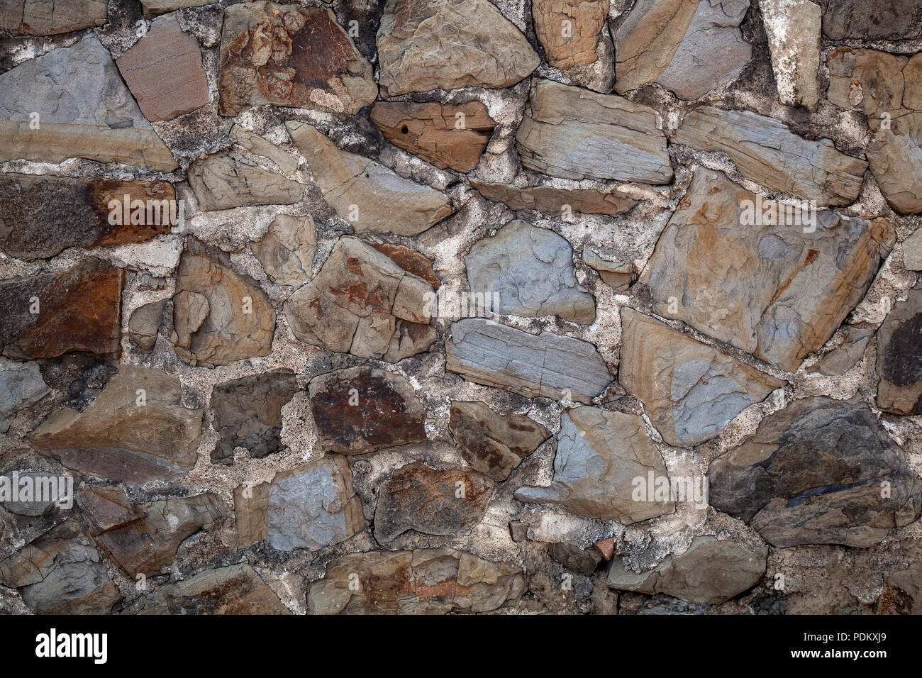 Grey stone wall of an old building, background texture of a brick Stock ...