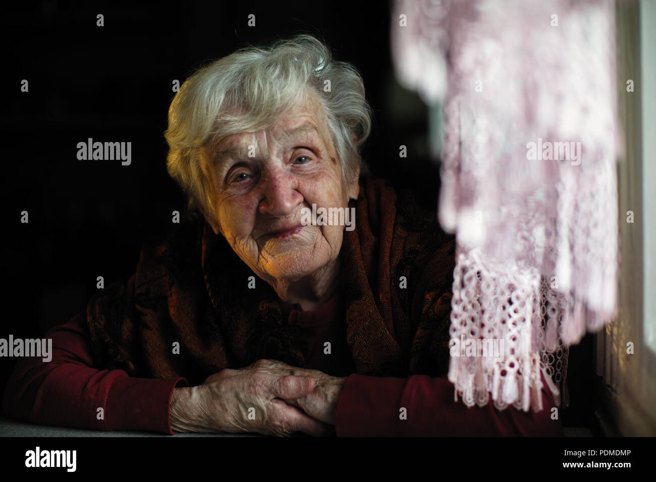 Sad elderly lady sitting in hi-res stock photography and images - Alamy