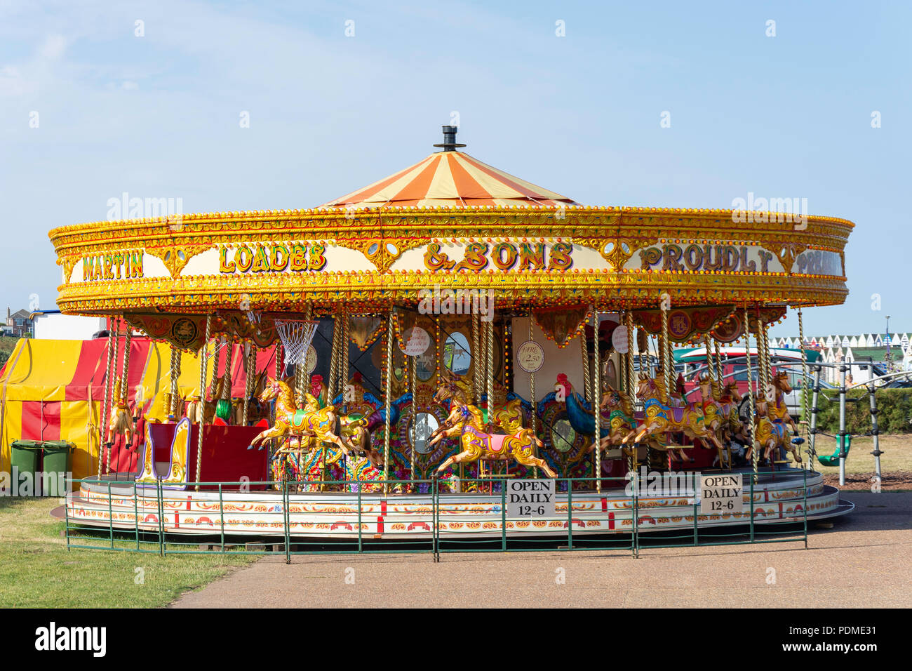 Children's carousel on beach promenade, Southwold, Suffolk, England, United Kingdom Stock Photo