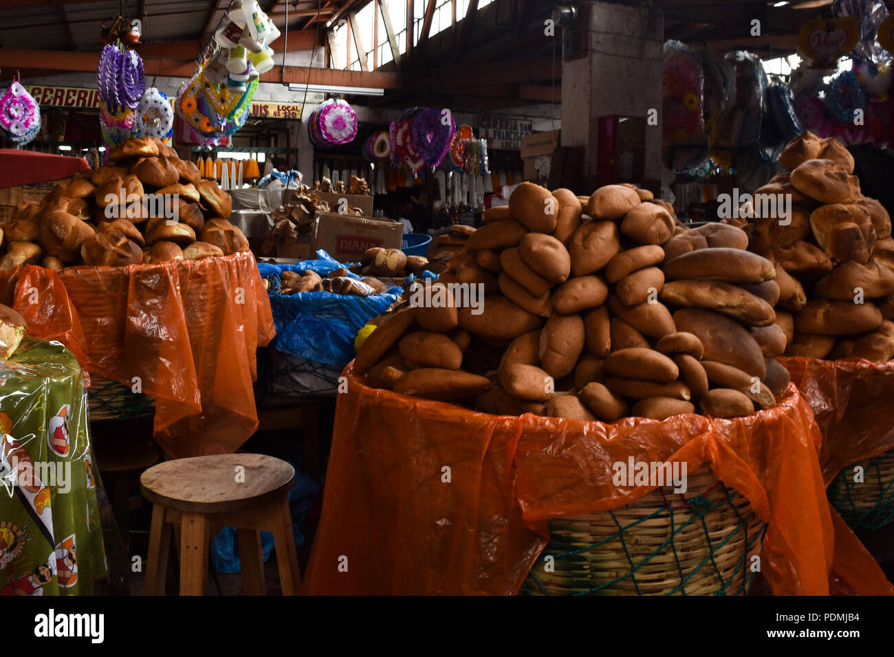 Full baskets of traditional bread in San Marcos, Guatemala Stock Photo ...