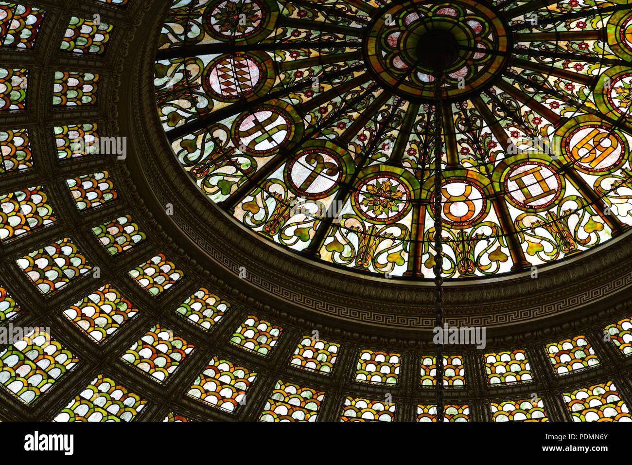 Opened in 1897 as the first public library, the Chicago Cultural Center Bradley Hall features elegant marble mosaic's and largest Tiffany glass dome Stock Photo