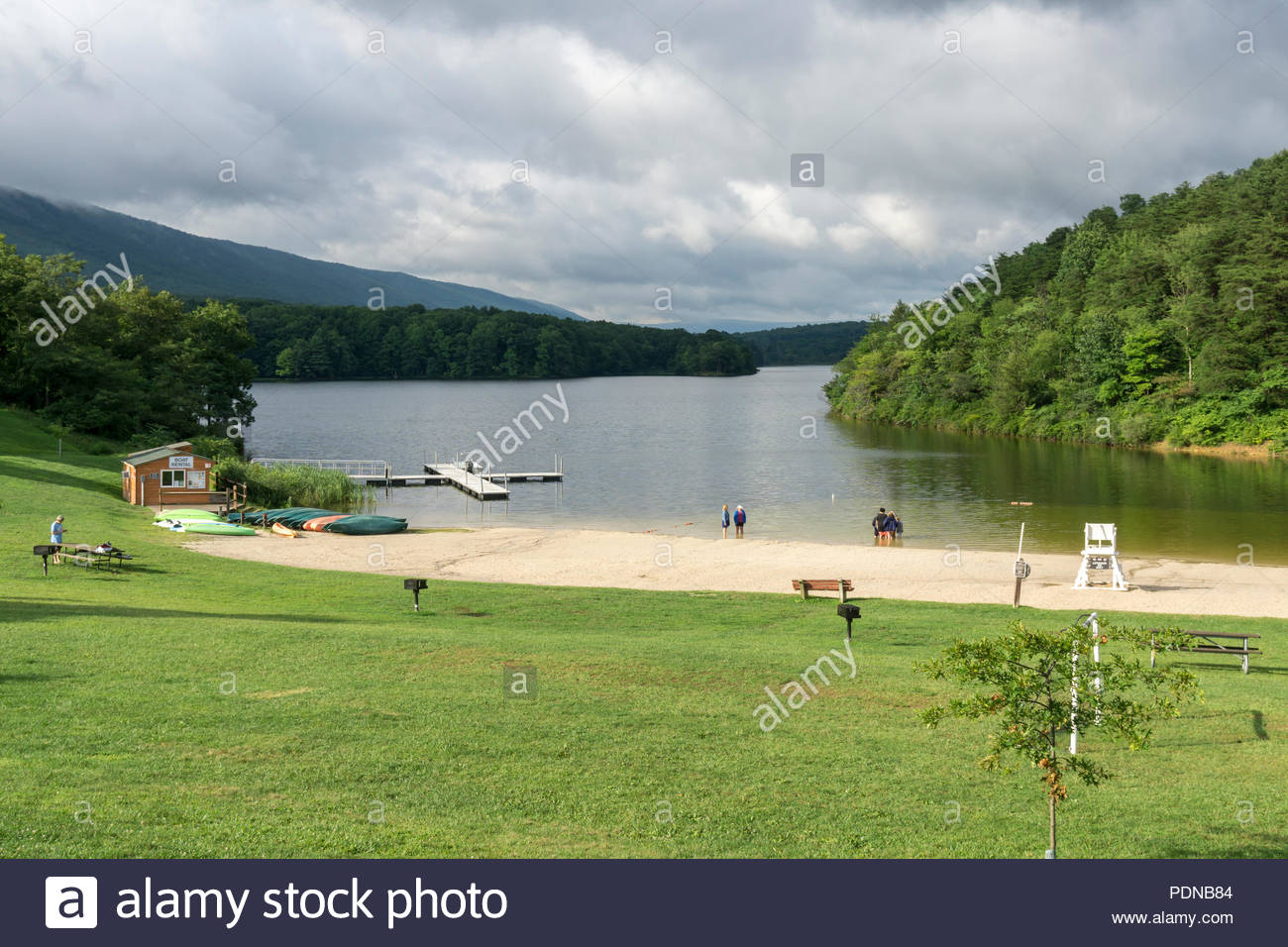 Vacationers Visit A Beach On Lake Habeeb At Rocky Gap State Park