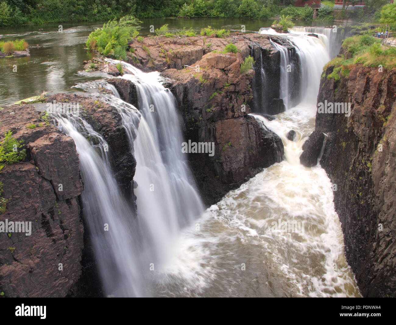 The great falls in Paterson, NJ after heavy rains increasing the flow. Stock Photo
