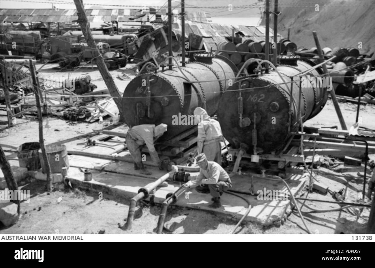 2 131738 THESE TANKS, EACH HOLDING 5 TONS, ARE BEACHHEAD RESERVOIRS IN WHICH MUSTARD GAS IS