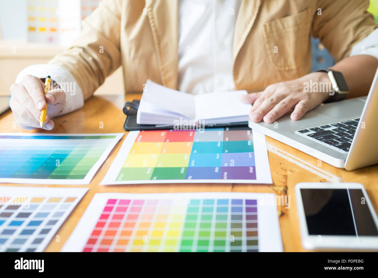 Creative Graphic designer at work. Color swatch samples pantone palette