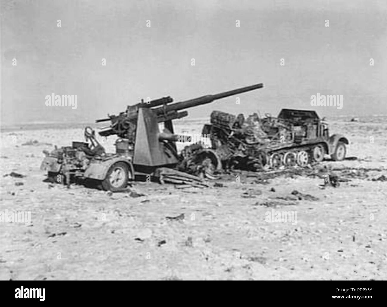 28 Burnt-out 88 mm Flak 36 near El Alamein 1942 Stock Photo