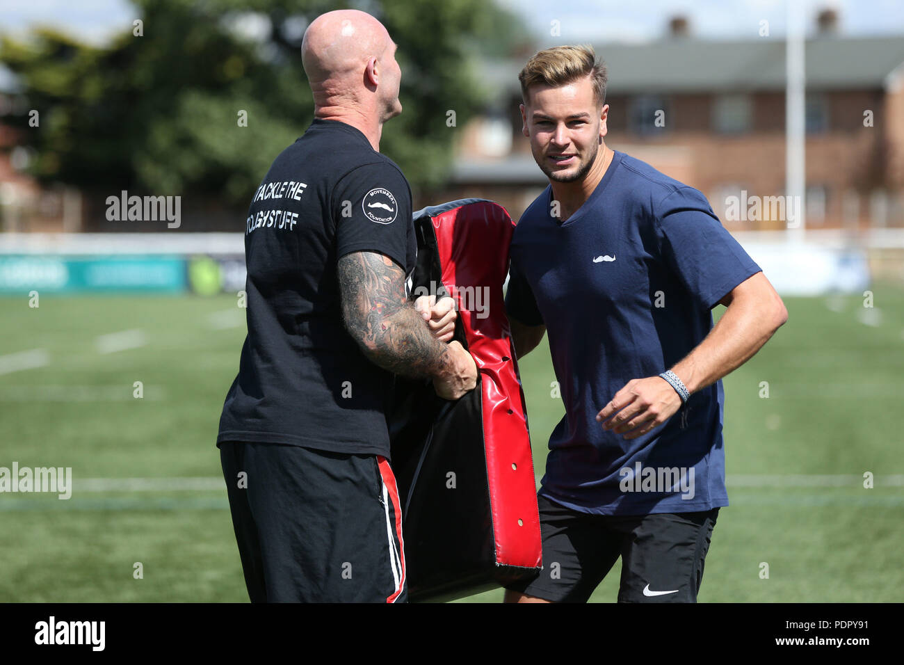 Reality TV star Chris Hughes (right) with former England Rugby League professional Keith Senior, in training in Ealing, London, representing The Movember Foundation in the Half Time Challenge at the Challenge Cup final on Saturday 25th August. Stock Photo