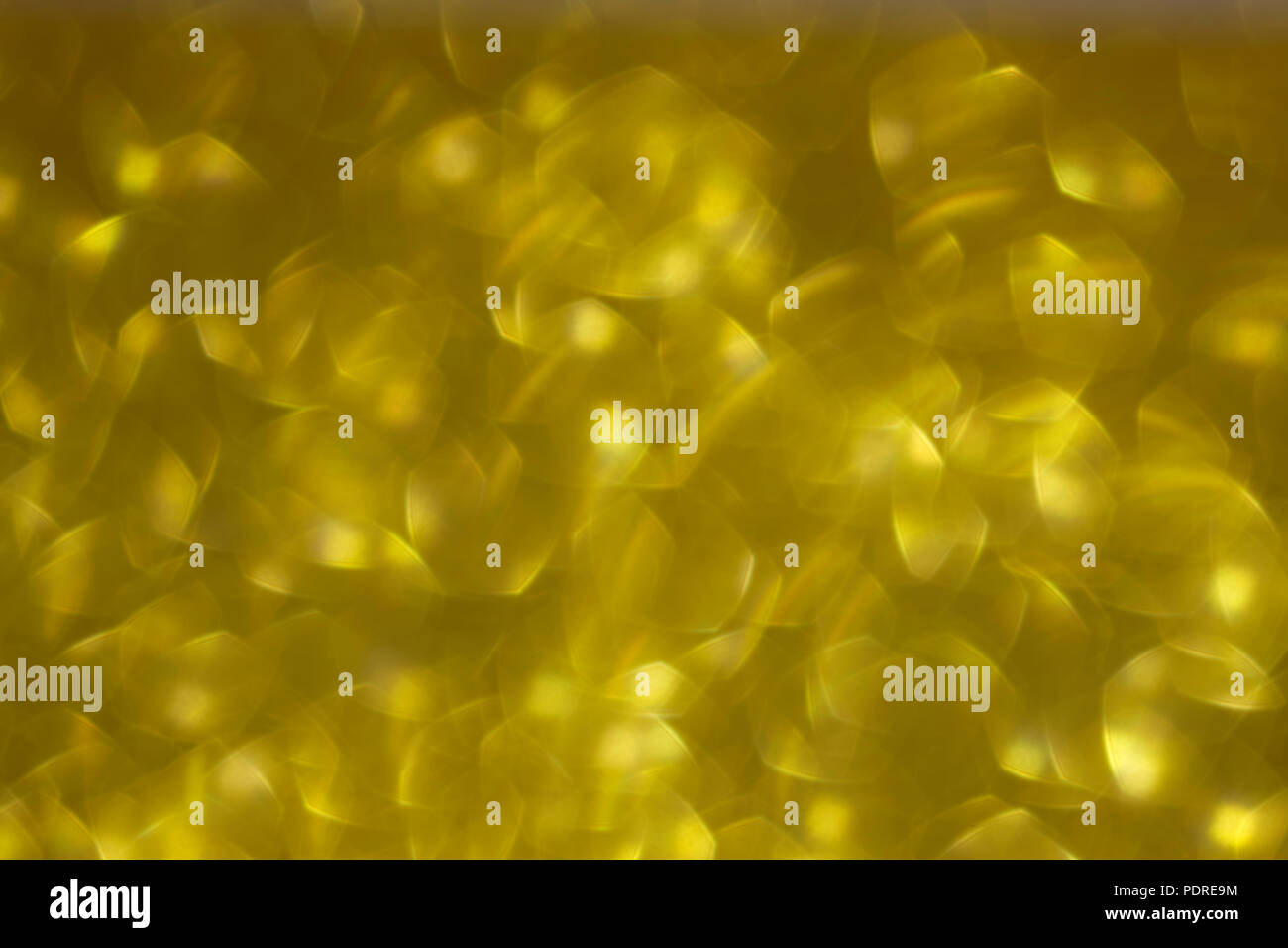 Shiny gold abstract background with a bokeh effect Stock Photo - Alamy